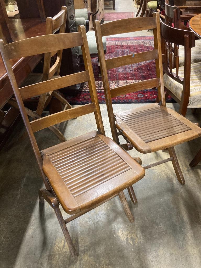 A set of eight early 20th century beech folding garden chairs